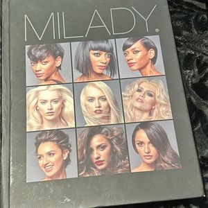 Hardcover Milady cosmetology textbook